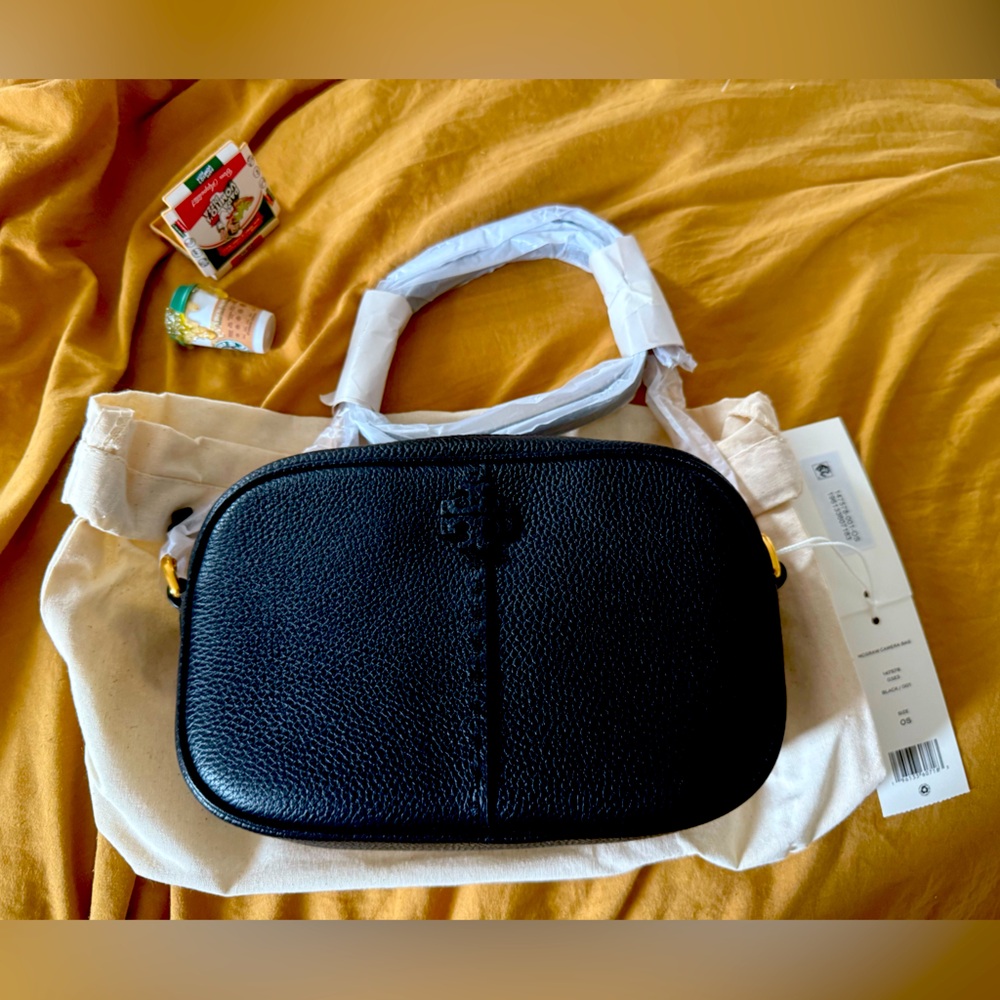 The McGraw Camera Bag is softly structured in pebbled leather.